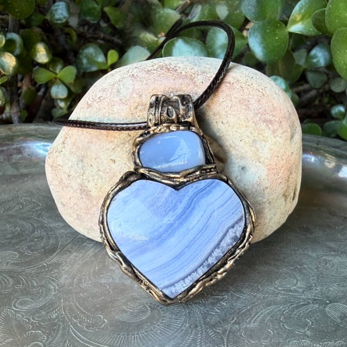Heart stone pendant necklace with natural Blue Lace Agate and Chalcedony stones, handcrafted healing crystal amulet in soft blue tones.