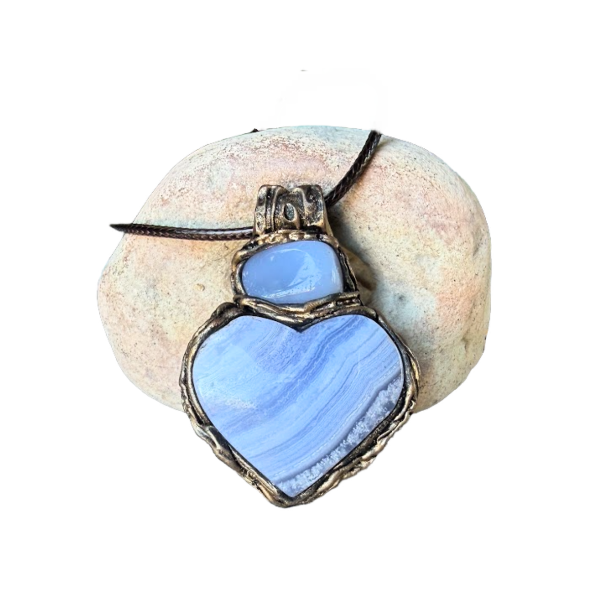 Heart stone pendant necklace with natural Blue Lace Agate and Chalcedony stones, handcrafted healing crystal amulet in soft blue tones.
