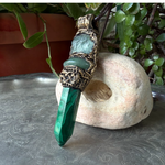 Malachite, Green Aventurine and Fluorite pendant necklace with green gemstones and crystal point in a handcrafted sculptural setting.