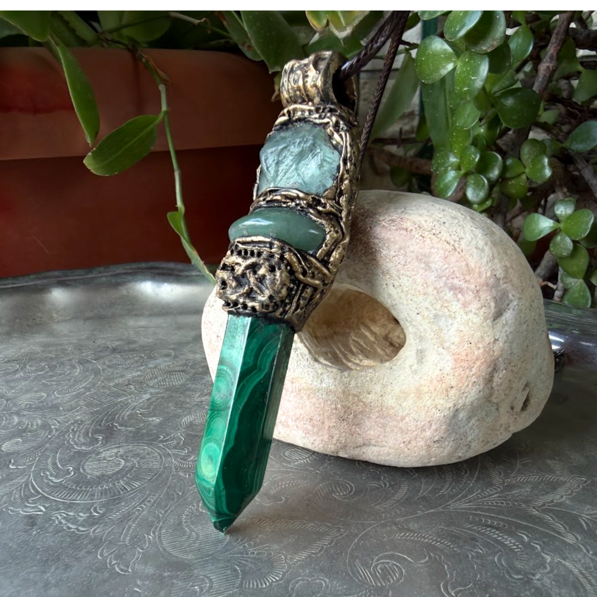 Malachite, Green Aventurine and Fluorite pendant necklace with green gemstones and crystal point in a handcrafted sculptural setting.