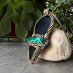 Handmade Obsidian and Malachite statement pendant necklace featuring contrasting black and green gemstones in a bold, one-of-a-kind crystal amulet design.