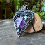 Sculptural heart pendant necklace with central purple Amethyst, dark textured setting and polished Hematite stones.