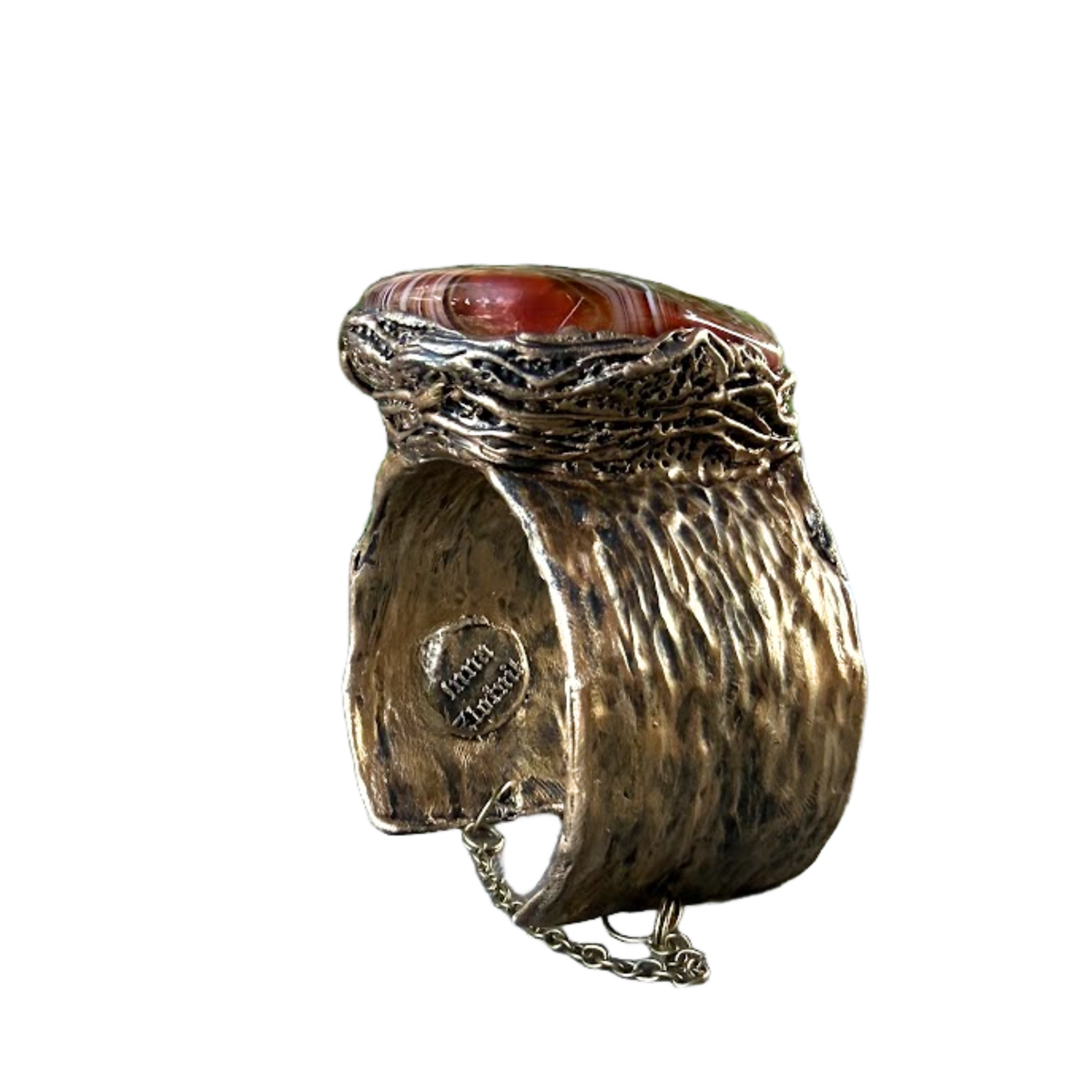 Wide statement cuff bracelet with an exceptionally large natural Sardonyx displaying red, rust, cream and white banded patterns.