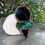 Handmade Obsidian and Malachite statement pendant necklace featuring contrasting black and green gemstones in a bold, one-of-a-kind crystal amulet design.