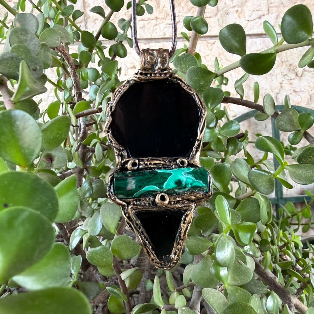 Handmade Obsidian and Malachite statement pendant necklace featuring contrasting black and green gemstones in a bold, one-of-a-kind crystal amulet design.