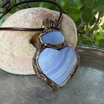 Heart stone pendant necklace with natural Blue Lace Agate and Chalcedony stones, handcrafted healing crystal amulet in soft blue tones.