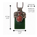Large green Jade pendant necklace with red Carnelian stones in a handcrafted sculptural amulet setting.