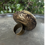 Oversized Citrine and Carnelian statement ring with a large pale yellow natural crystal and smaller reddish-brown stone in a sculptural setting.