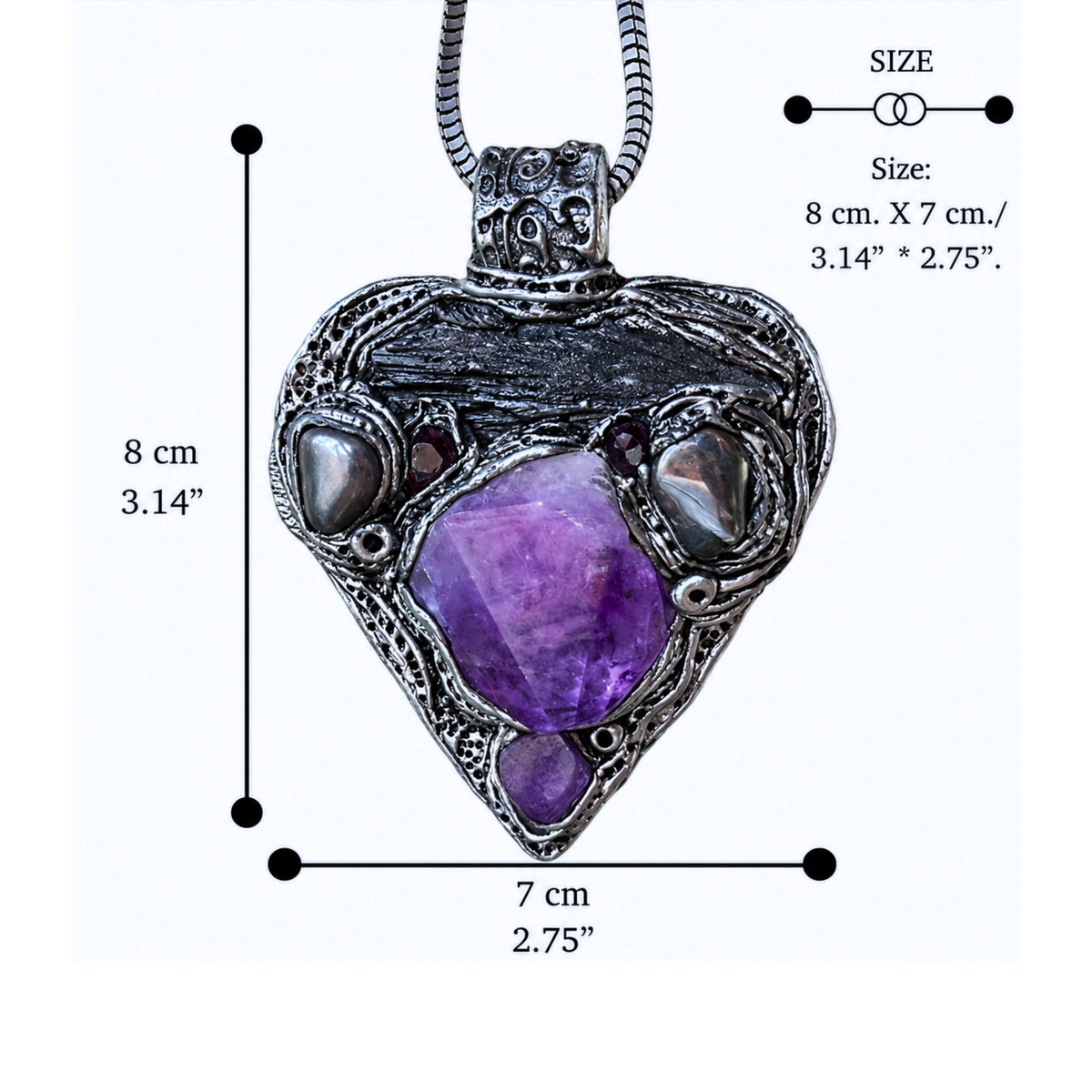 Sculptural heart pendant necklace with central purple Amethyst, dark textured setting and polished Hematite stones.