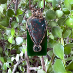 Large Bloodstone and green Jade pendant necklace with natural red-speckled Bloodstone in a handcrafted sculptural setting.