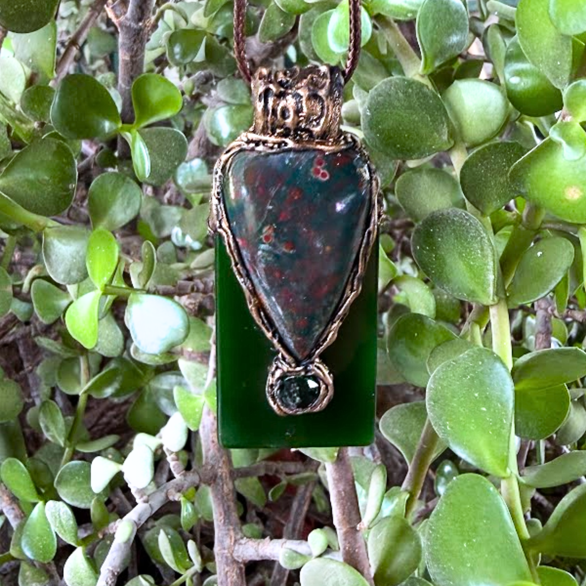 Large Bloodstone and green Jade pendant necklace with natural red-speckled Bloodstone in a handcrafted sculptural setting.