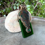 Large Bloodstone and green Jade pendant necklace with natural red-speckled Bloodstone in a handcrafted sculptural setting.
