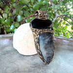 Large Tourmalinated Quartz and Black Onyx pendant necklace with black and translucent natural stones in a handcrafted sculptural setting.