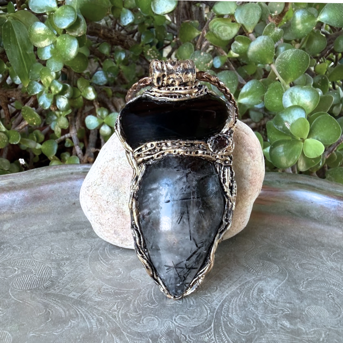 Large Tourmalinated Quartz and Black Onyx pendant necklace with black and translucent natural stones in a handcrafted sculptural setting.