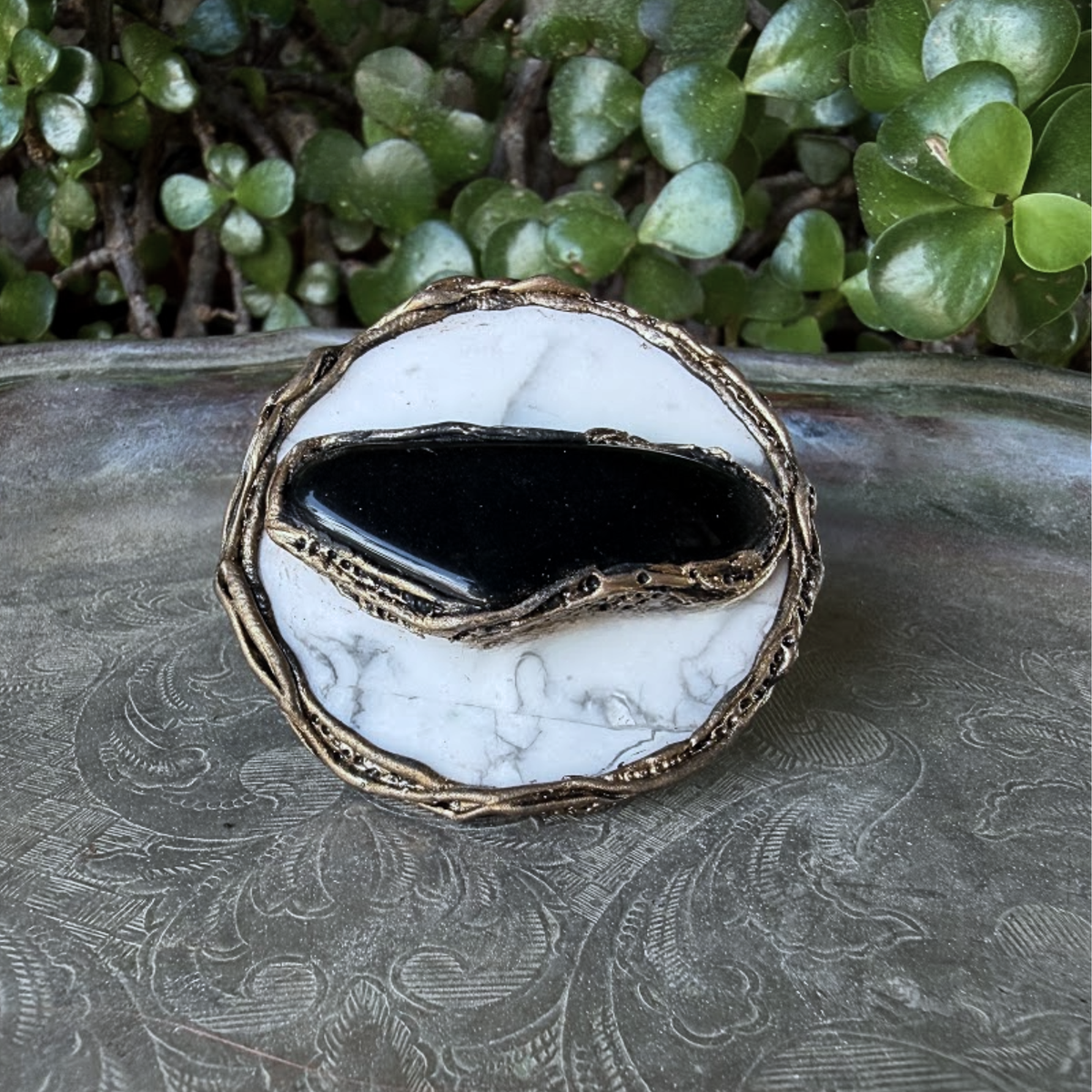 Large round Hawk’s Eye and white Howlite statement ring with a horizontal dark stone in a handcrafted sculptural setting.