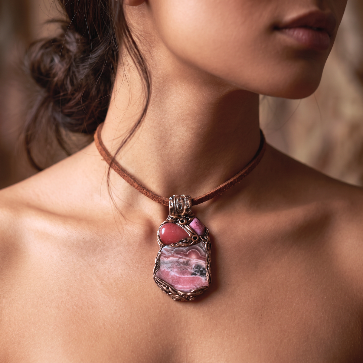 Handmade large pink crystal pendant necklace featuring Rhodochrosite, Ruby and Cherry Quartz gemstones in a sculptural one-of-a-kind love amulet design.