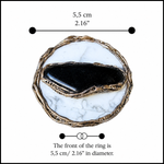 Large round Hawk’s Eye and white Howlite statement ring with a horizontal dark stone in a handcrafted sculptural setting.