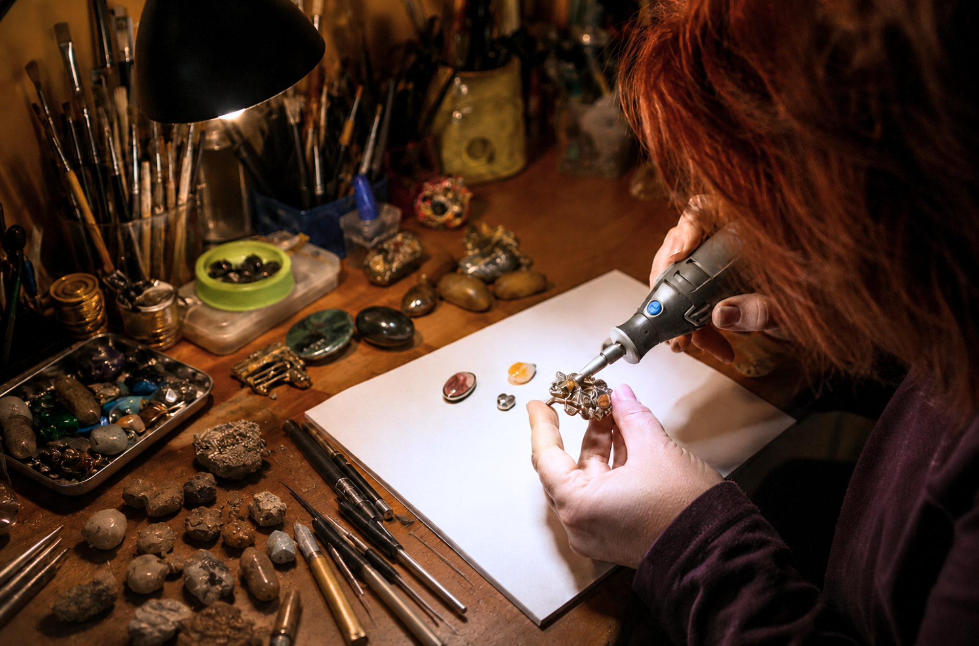 Inna Zlotnik is creating gemstone jewelry in the studio.