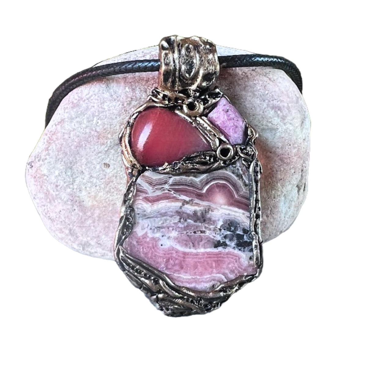 Handmade large pink crystal pendant necklace featuring Rhodochrosite, Ruby and Cherry Quartz gemstones in a sculptural one-of-a-kind love amulet design.