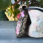 Handmade large pink crystal pendant necklace featuring Rhodochrosite, Ruby and Cherry Quartz gemstones in a sculptural one-of-a-kind love amulet design.
