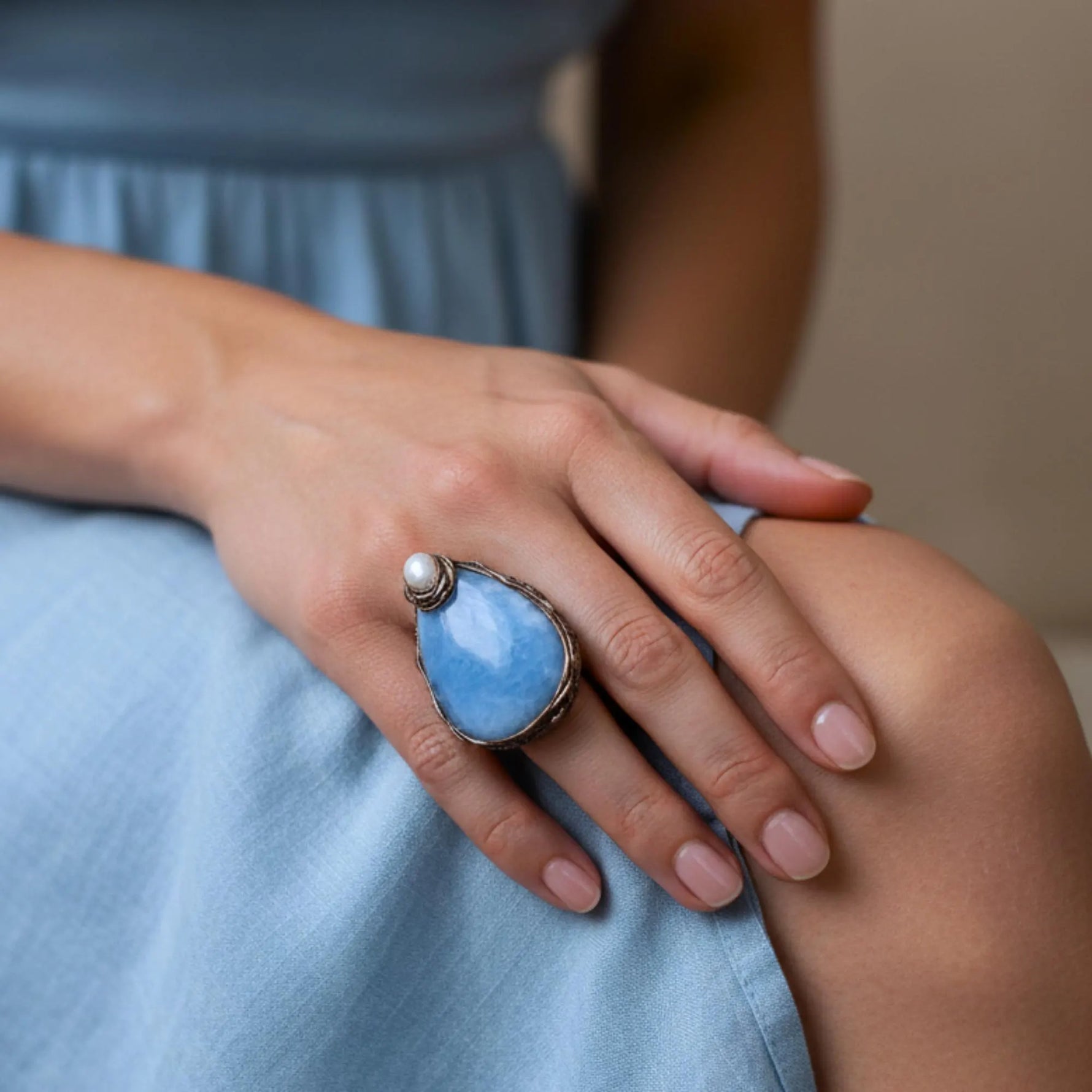Oversized aquamarine and pearl teardrop cocktail ring, light blue statement gemstone jewelry.