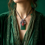 Large green Jade pendant necklace with red Carnelian stones in a handcrafted sculptural amulet setting.
