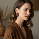 Carnelian statement clip-on earrings with rectangular and round red stones in a handcrafted geometric setting.