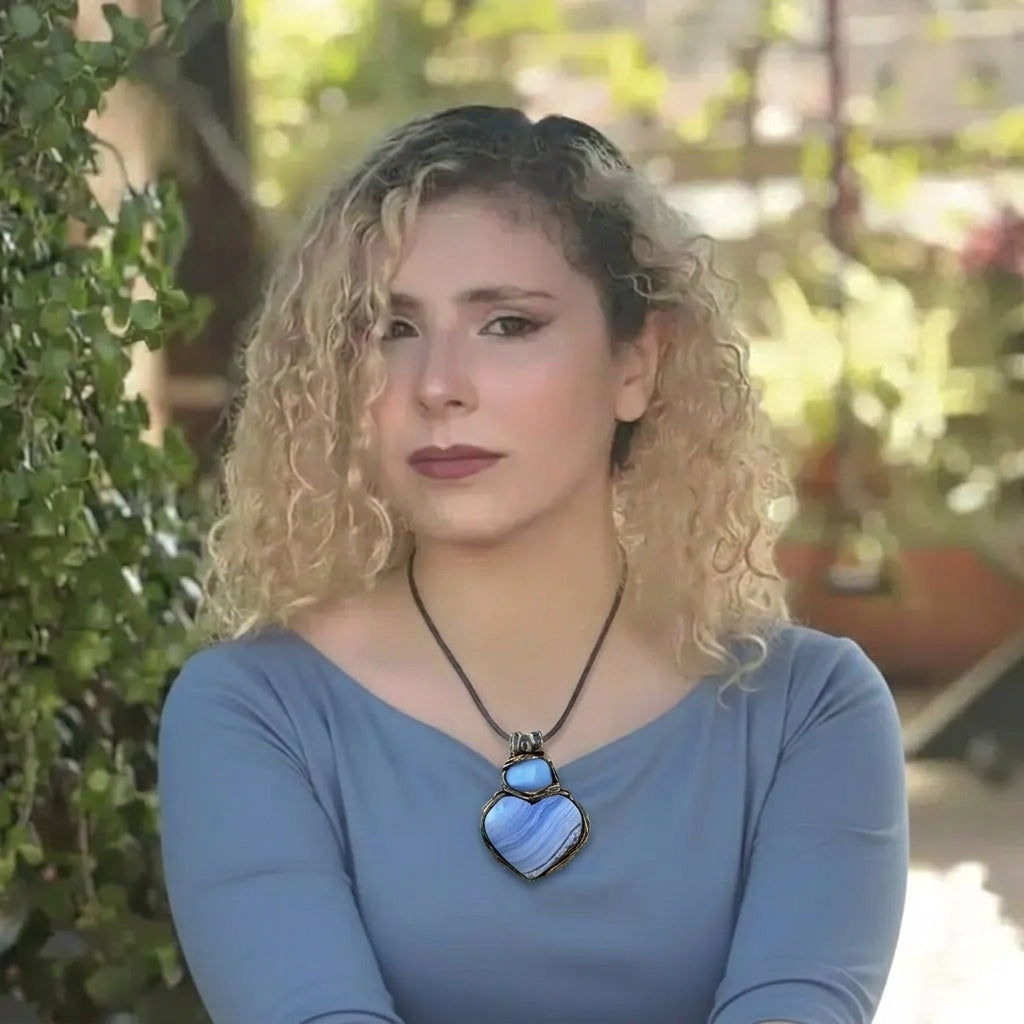 Heart stone pendant necklace with natural Blue Lace Agate and Chalcedony stones, handcrafted healing crystal amulet in soft blue tones.